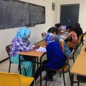Intermediate Students working together on grammar lessons at the Azrou Center.